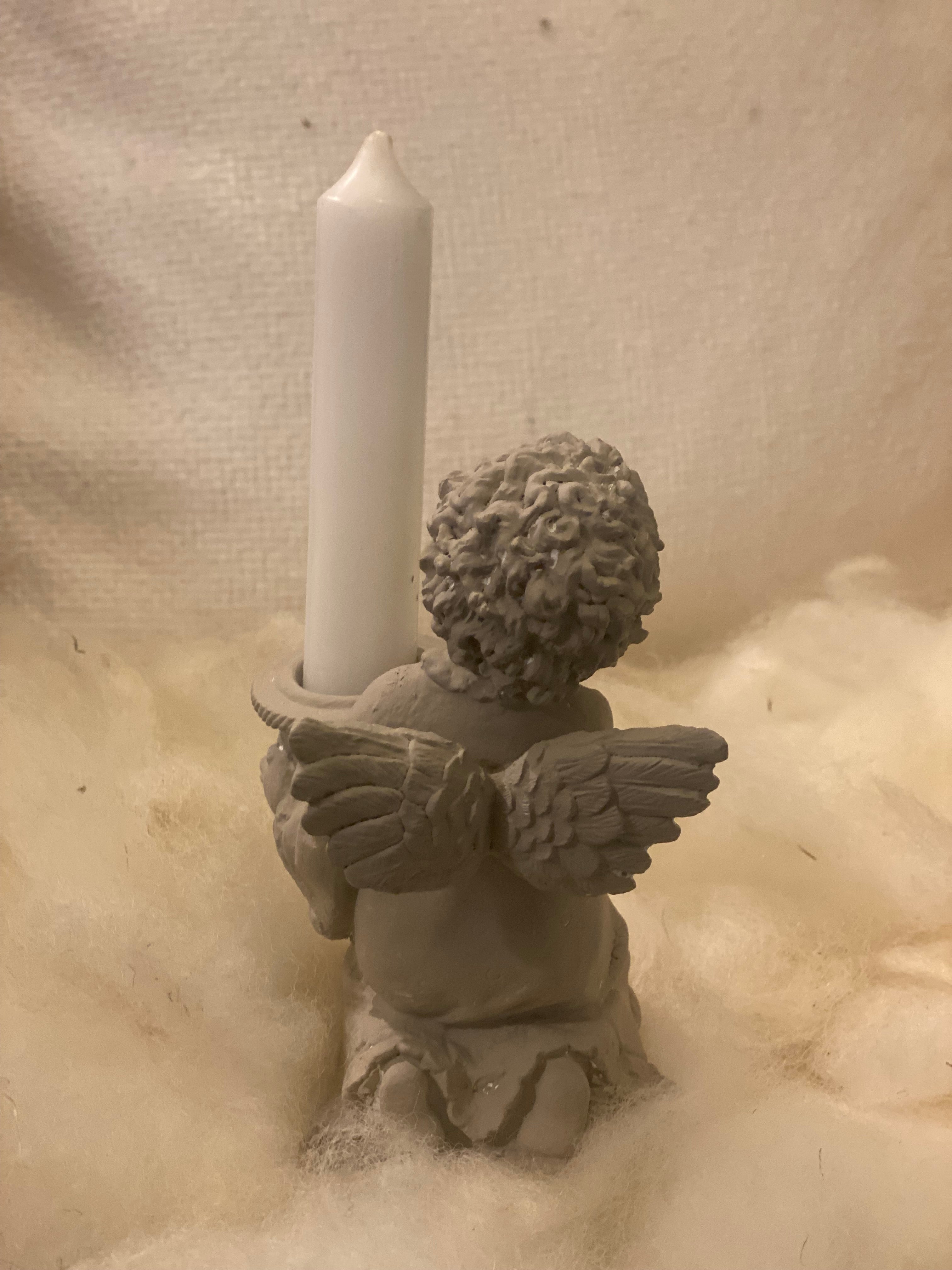 Engel kaarsen houder