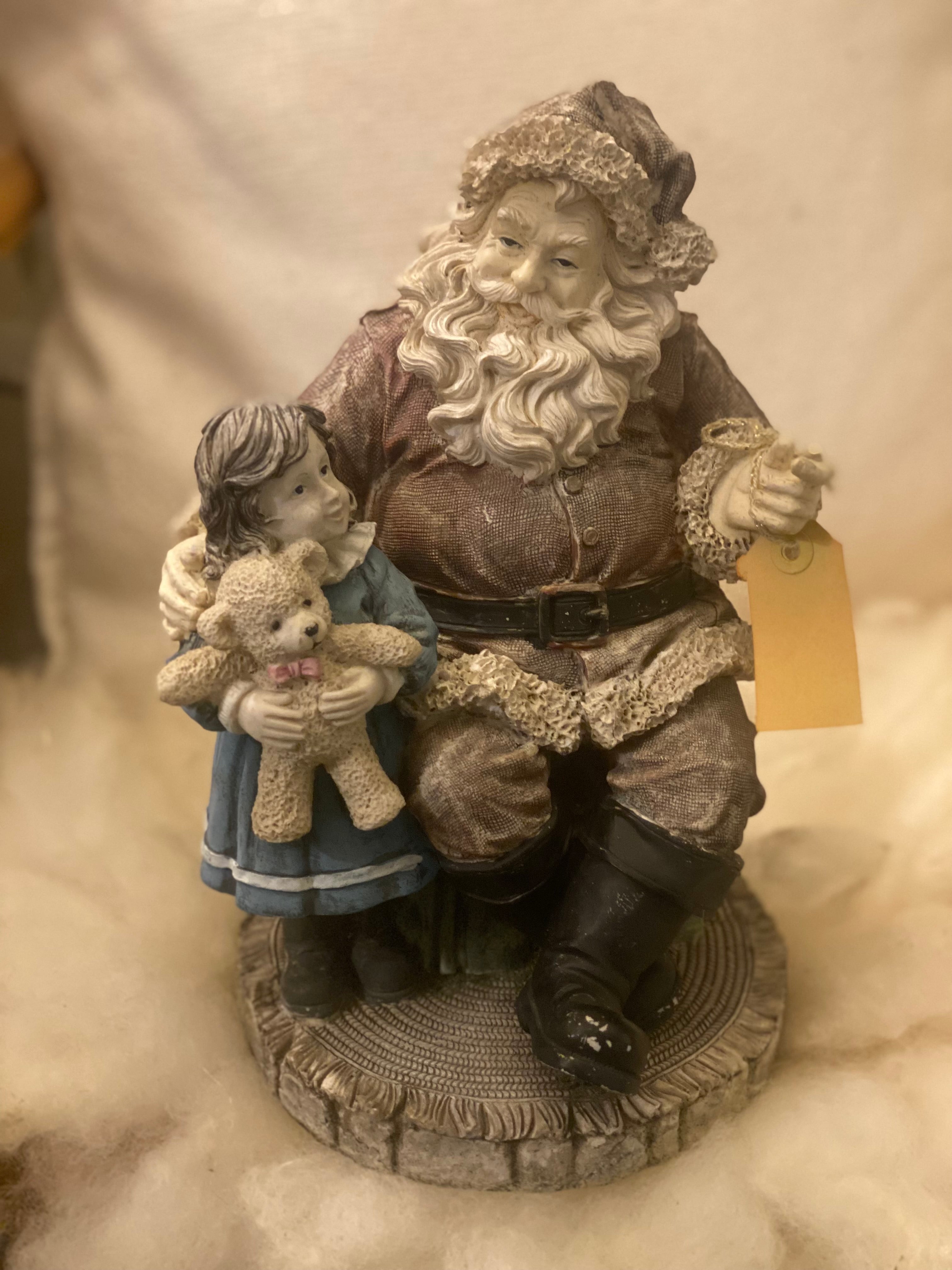 Vintage kerstman met kind op schoot