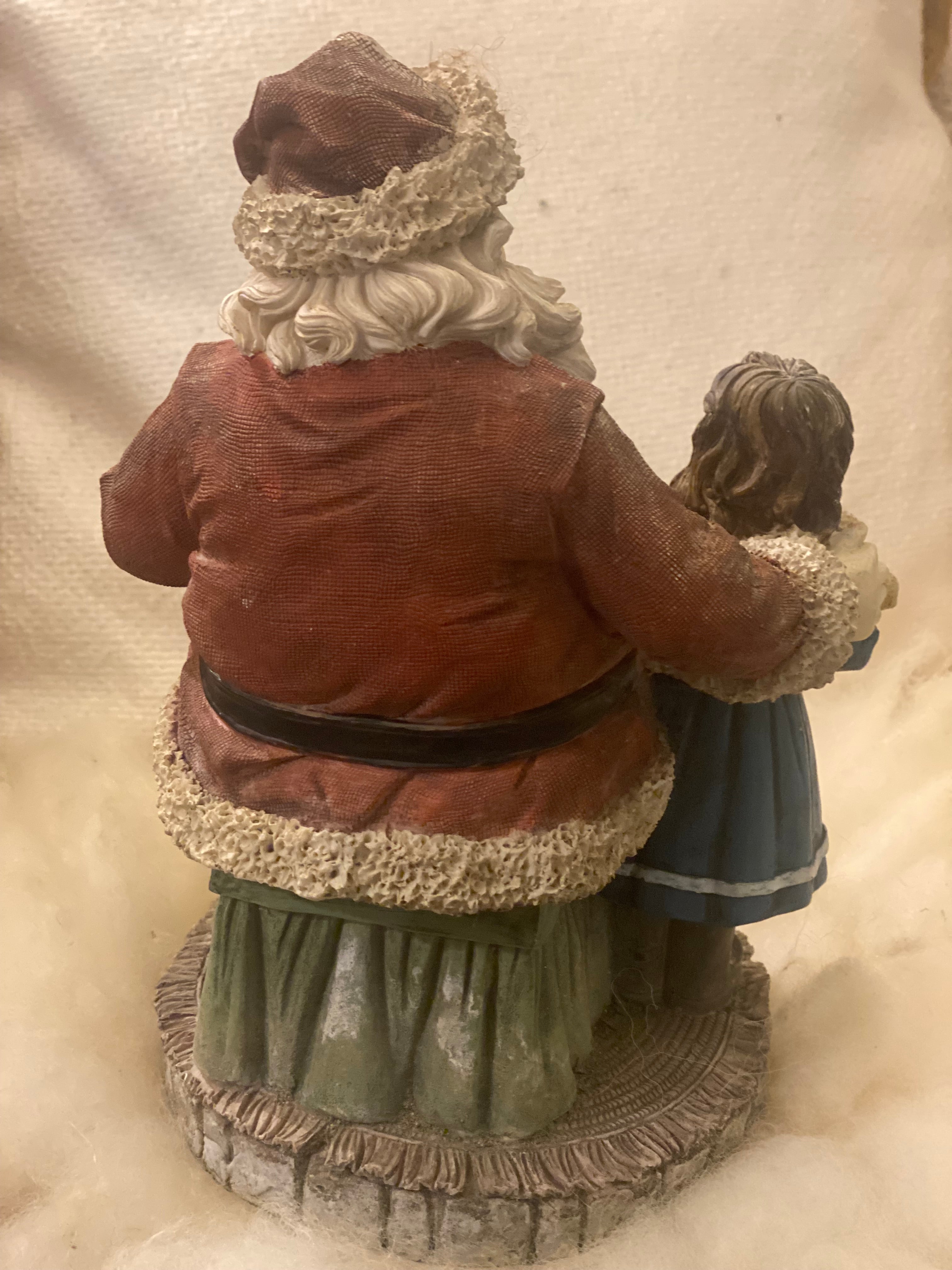 Vintage kerstman met kind op schoot