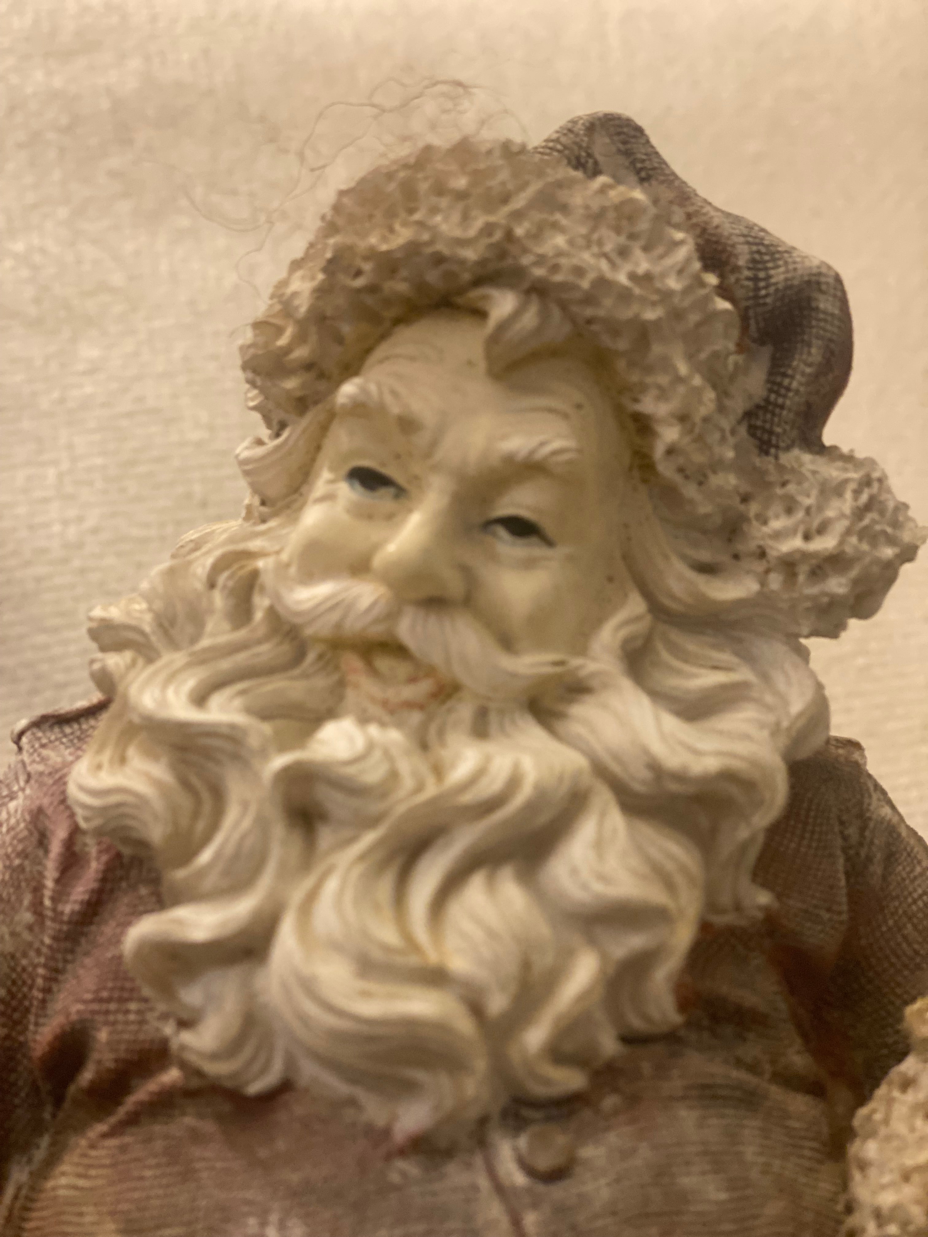 Vintage kerstman met kind op schoot